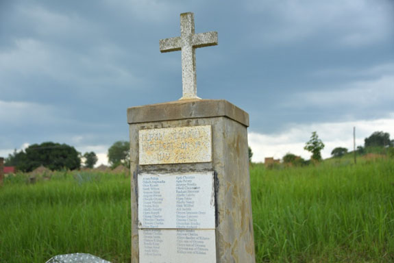 The massacre site has a concrete monument in Lukodi Village with the names of the 60 people who were killed