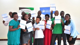 Human Rights Defenders receive certificates for a three-day training on monitoring and reporting human rights issues in Fort Portal, Kabarole district.