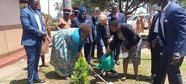 Ms. Mariam Wangadya the UHRC Chairperson, Mr. Guillaume Chartrain the Deputy Ambassador, EU Delegation with members of civil society organizations planting a tree at Luzira Upper Prison on 10 October 2022