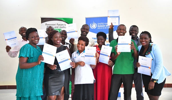 Human Rights Defenders get certificates after training on monitoring and reporting human rights. 